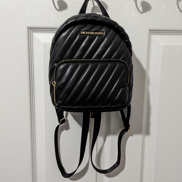 Michael Kors Handbags - NWT MK Erin small backpack